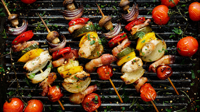 Grilling mushrooms and vegetables on skewers