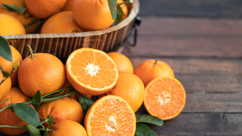 basket of oranges on table