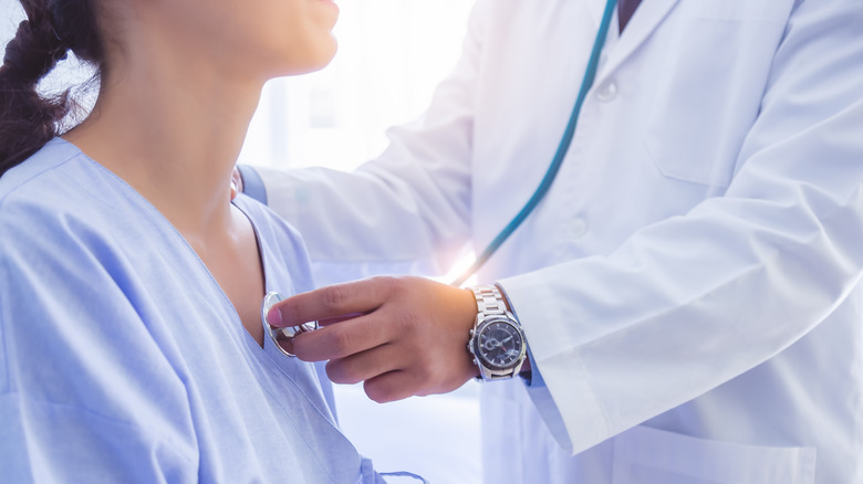 woman with doctor and stethoscope