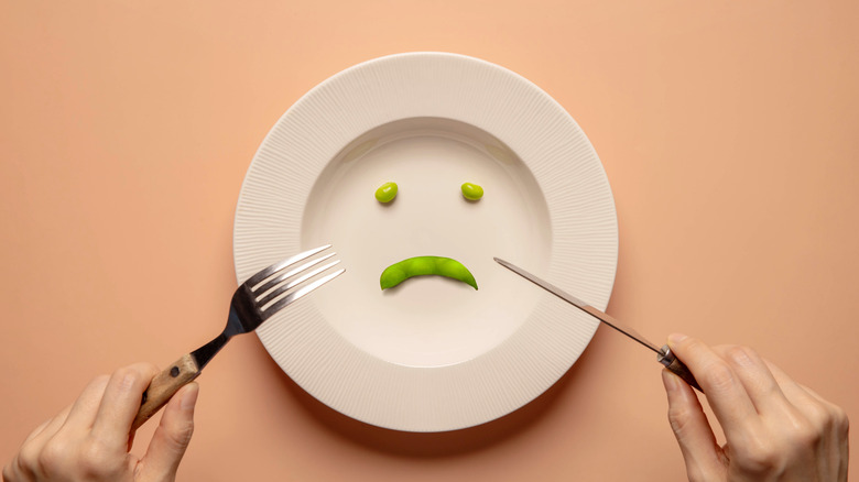 soybeans on white plate in shape of a frown