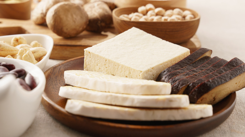 tofu on a plate with assorted foods in background