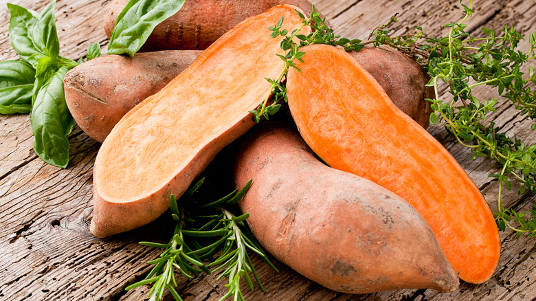 https://www.healthdigest.com/img/gallery/what-happens-to-your-body-when-you-eat-sweet-potatoes-every-day/intro-1638896342.jpg