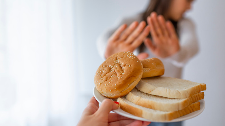 person rejecting white bread