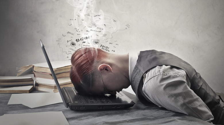 boy sleeping while studying