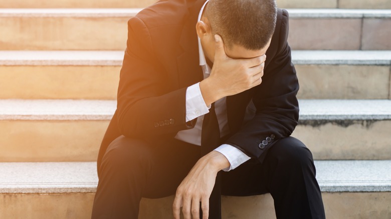 man in suit stressed out