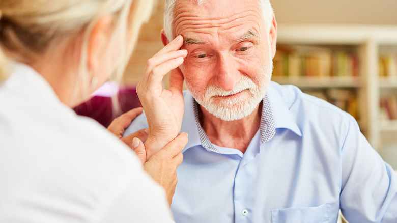 man talking to female doctor