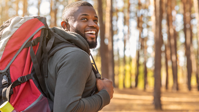 Smiling man on nature trail