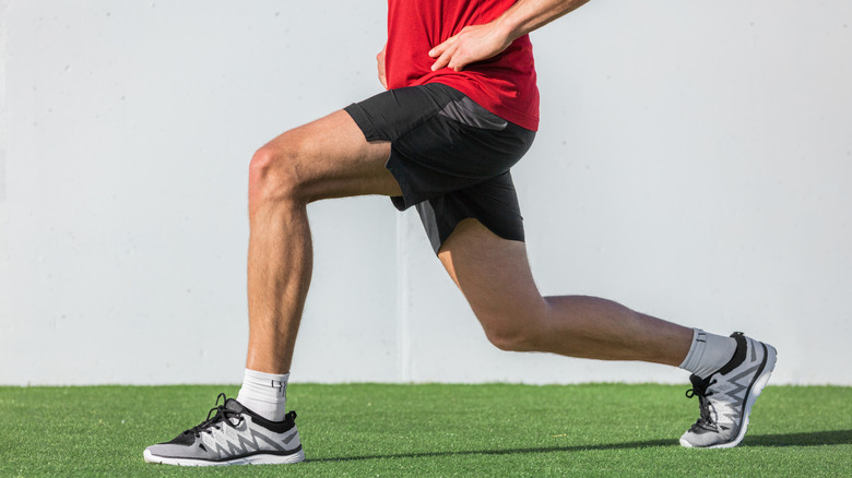 Close up of man doing lunges 