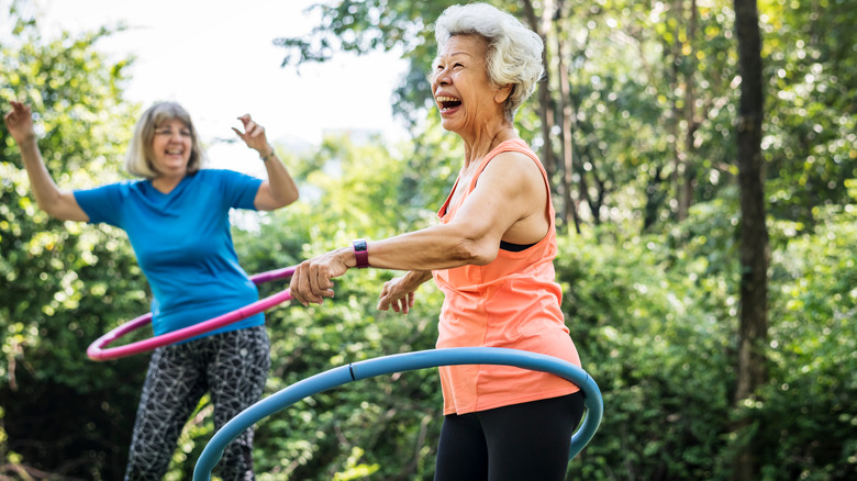 elderly women hula hooping