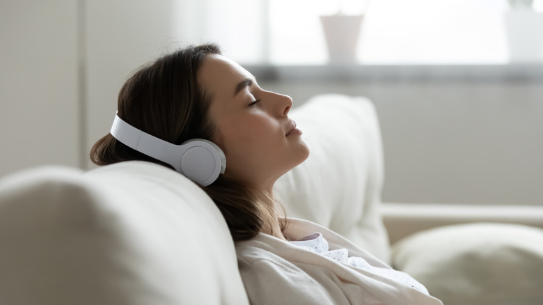 woman relaxing and sleeping with headphones