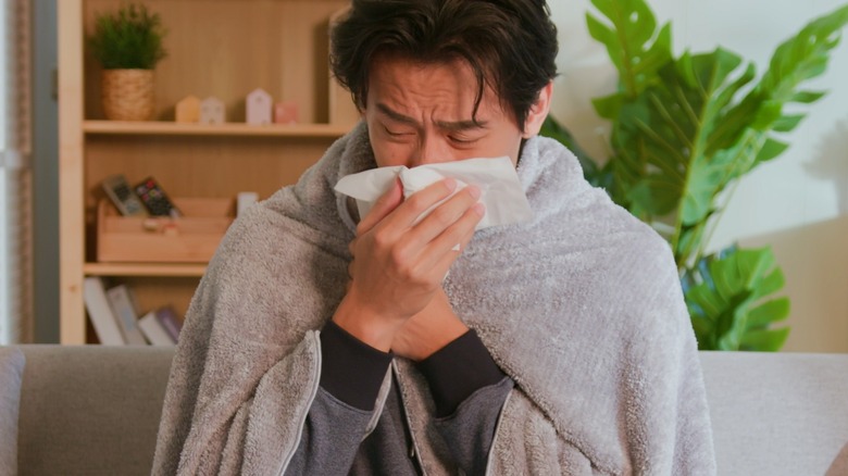 man with cold symptoms