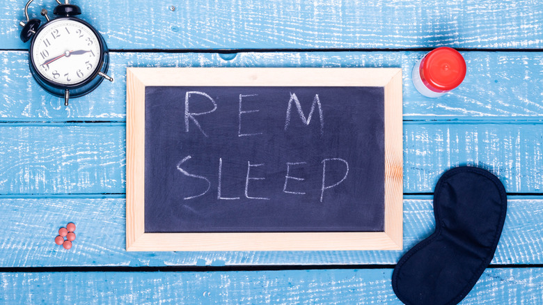 rem sleep written on chalk board