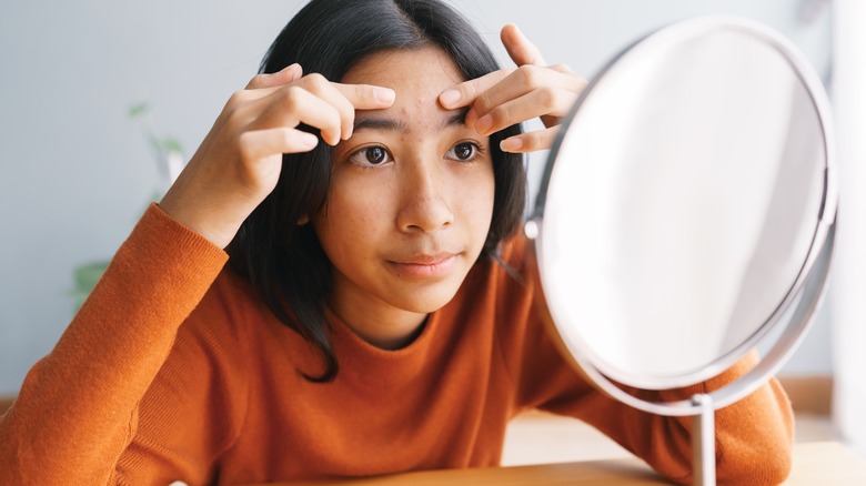 young woman with acne