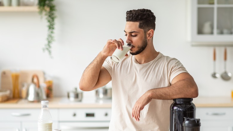 man drinking whey protein