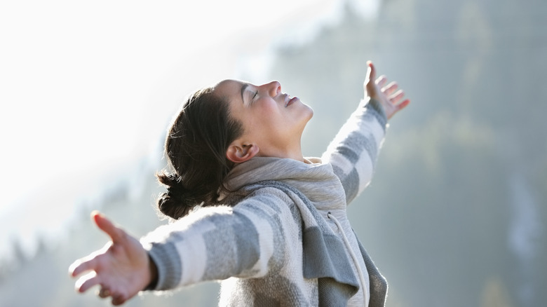 Woman outdoors happy and energetic