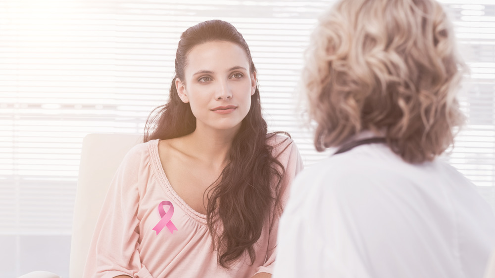 Woman talking to doctor