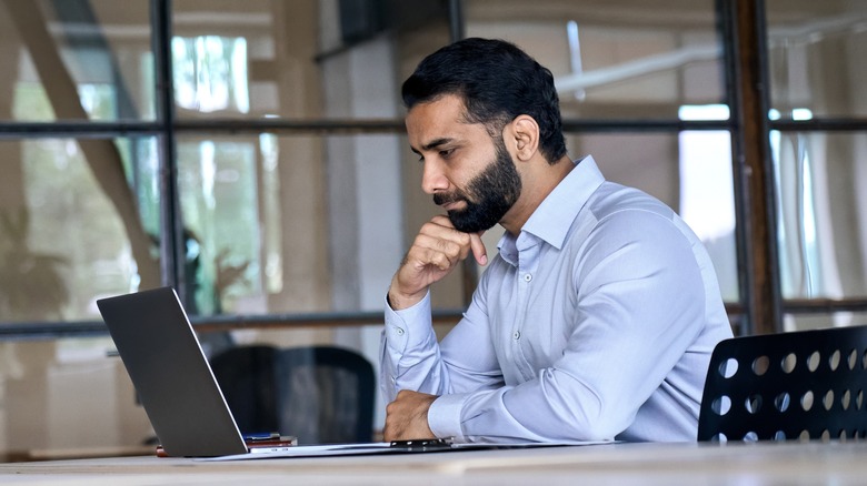 Man looking at laptop