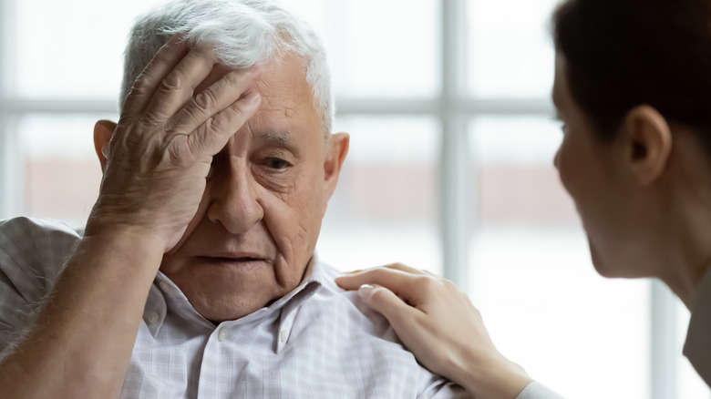 elderly man consults female physician