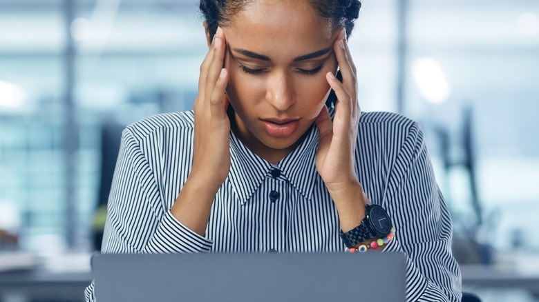 young woman sitting at desk 