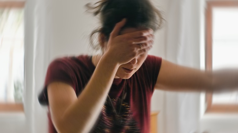 young woman suffering headache