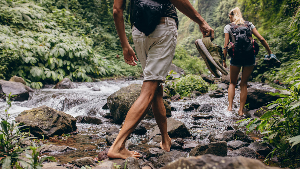 Couple walking barefoot