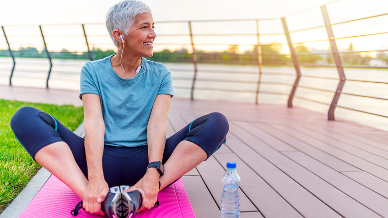 older woman stretching