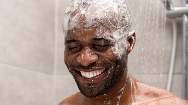 smiling man in shower