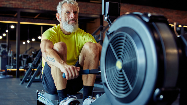 man on rowing machine