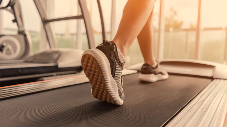 person's legs on treadmill