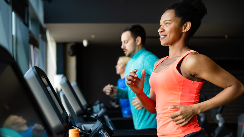 smiling on treadmill in gym