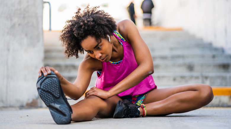 woman stretching outside