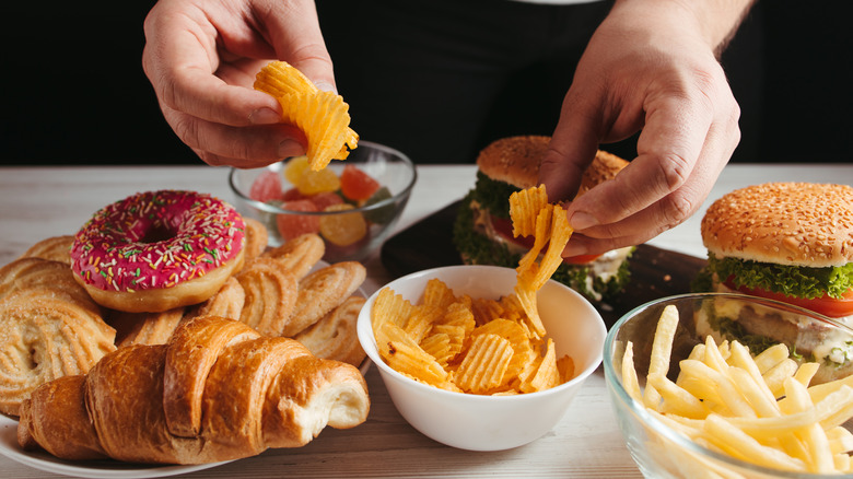 close up of junk food french fries doughnuts chips