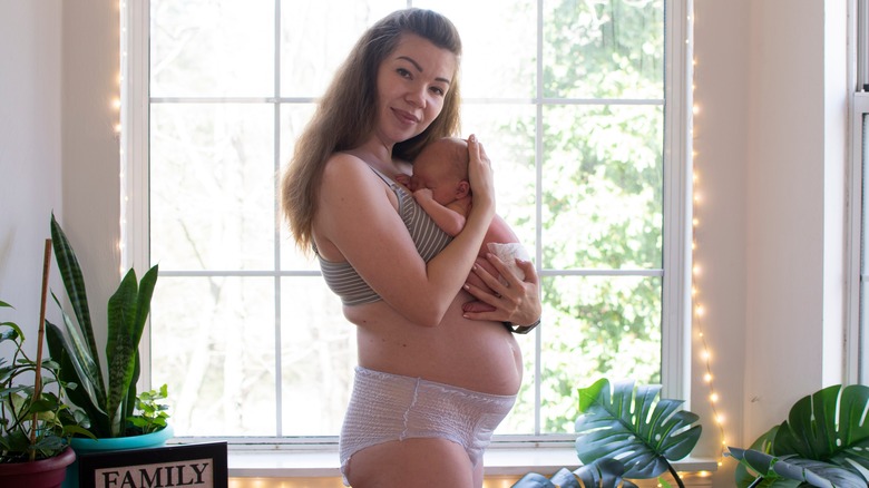 Woman holding newborn