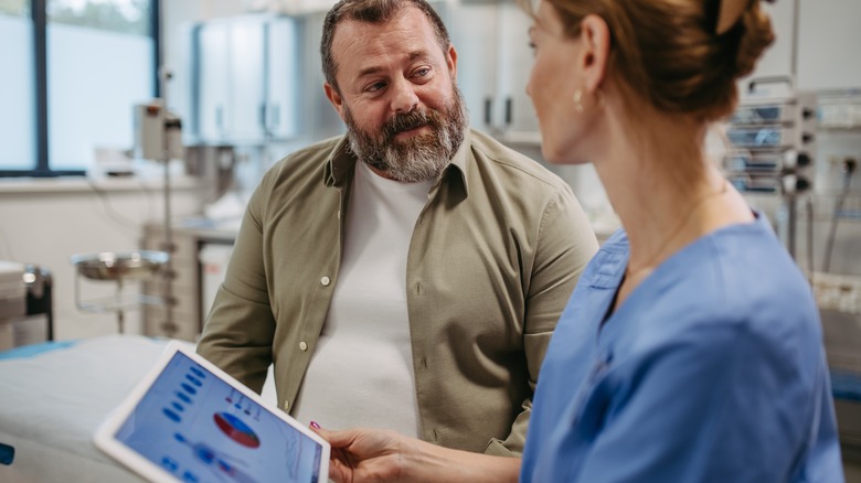 female doctor and male patient discussing test results