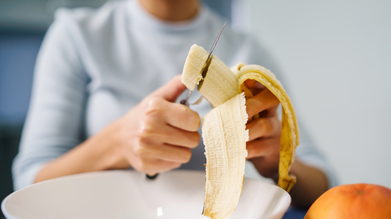 Slicing banana for breakfast