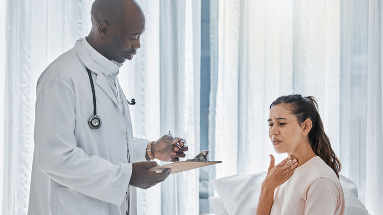 woman talking to doctor about thyroid
