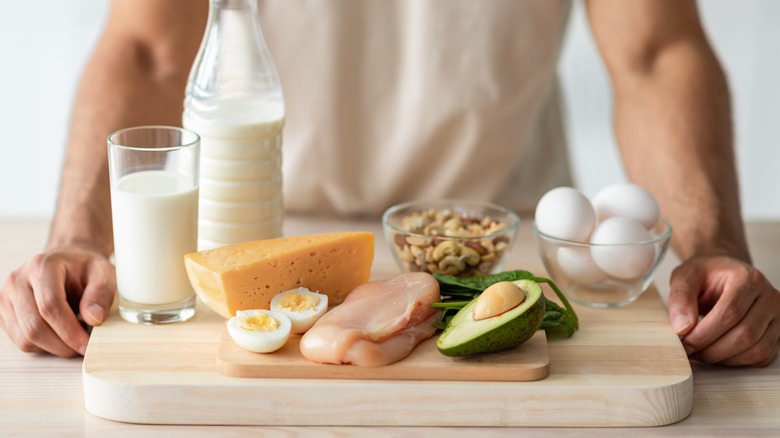 man with platter of protein-rich food