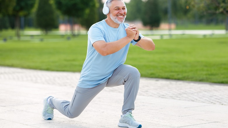 man doing lunges outdoors