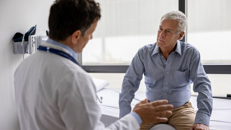 Man talking with doctor