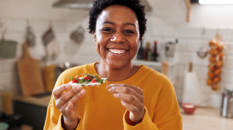 Woman smiling with food 