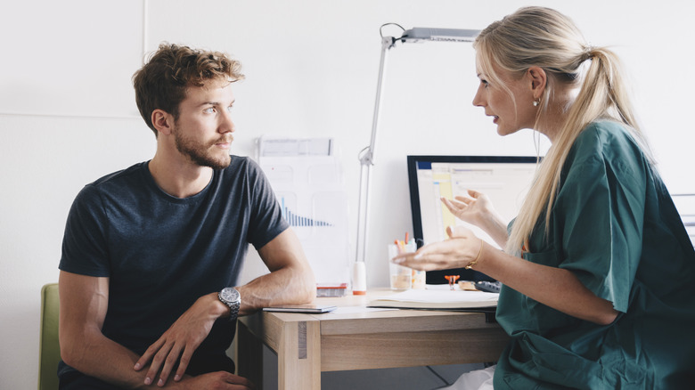 man talking with his doctor