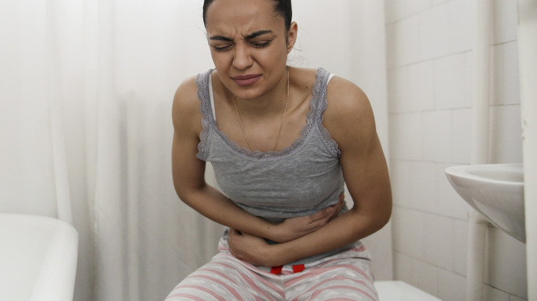 Woman experiencing constipation 