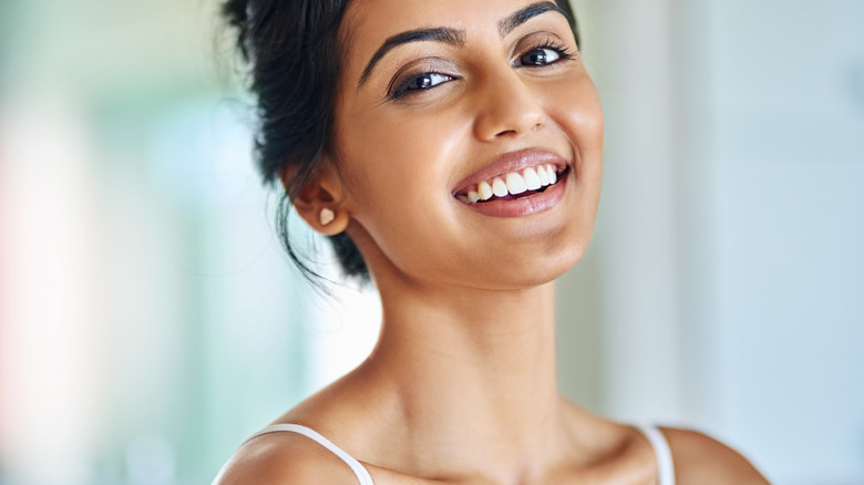smiling woman with radiant skin