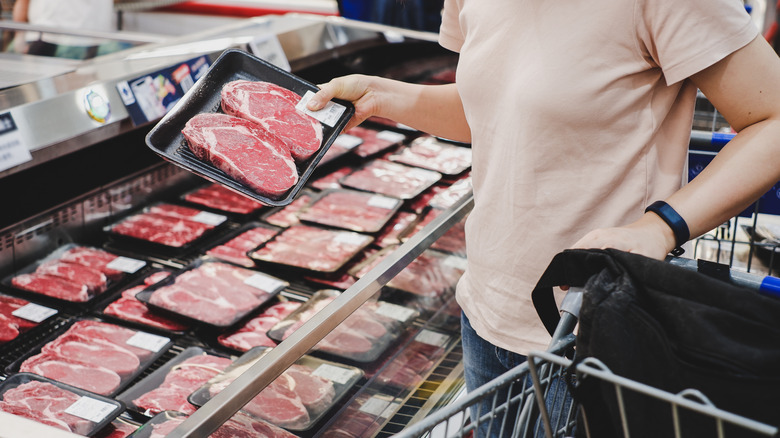 woman eating raw beef