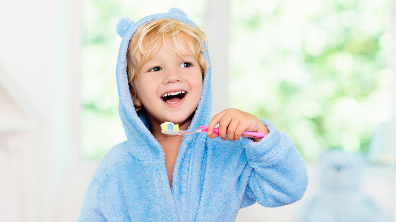 Little kid brushing teeth