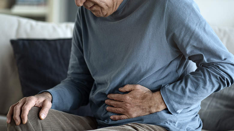 An older man with stomach pain