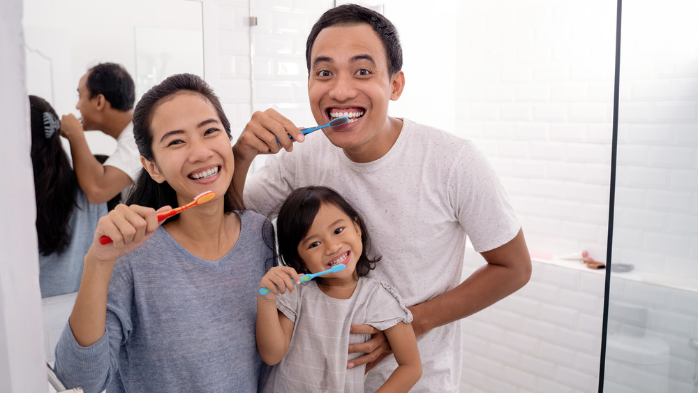 Family brushing teeth