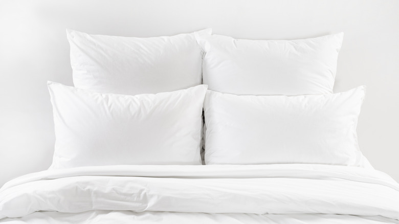 Bed with white linens and pillows
