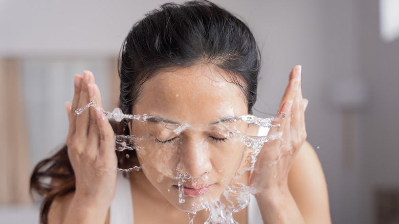 woman washing face