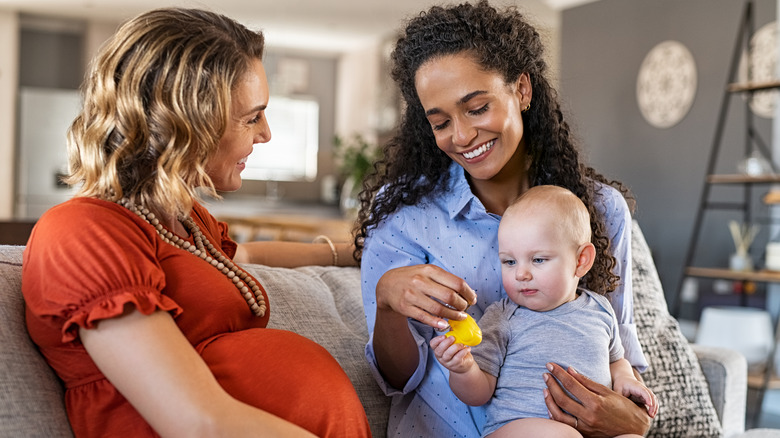 pregnant woman, woman, and baby